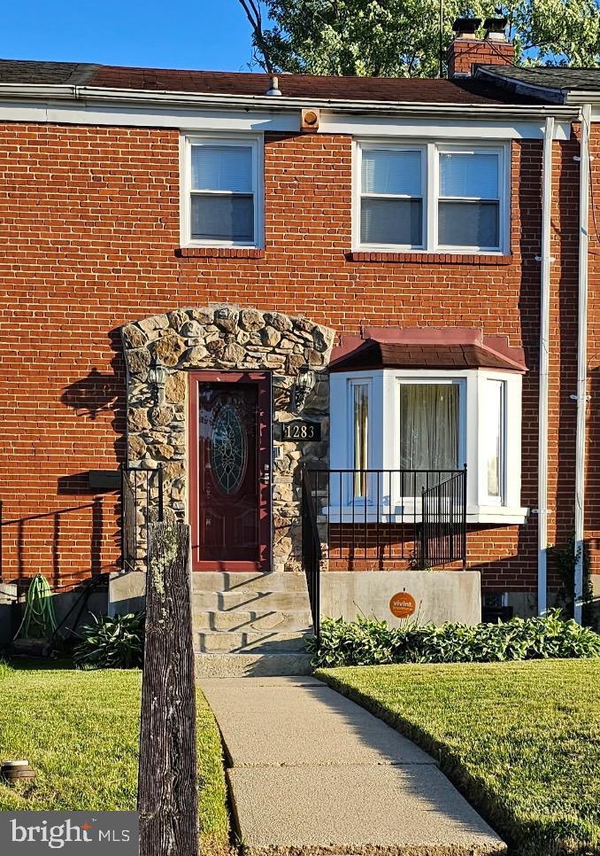 1283 Gittings Ave, Baltimore, MD 21239 - multi unit property featuring brick siding, stone siding, and a chimney