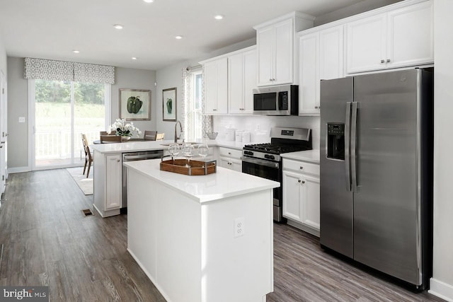 Park Ave Unit Clarendon 4Story, Baltimore, MD 21217 - kitchen featuring appliances with stainless steel finishes, a peninsula, dark wood-style flooring, a kitchen island, and recessed lighting