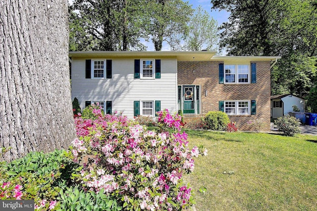 1326 Balsam St, Saint Leonard, MD 20685 - raised ranch featuring a front yard and brick siding