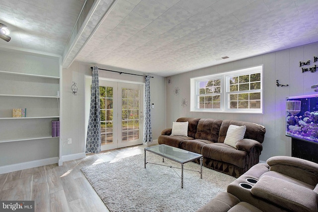 1326 Balsam St, Saint Leonard, MD 20685 - living room featuring french doors, healthy amount of natural light, and wood finished floors