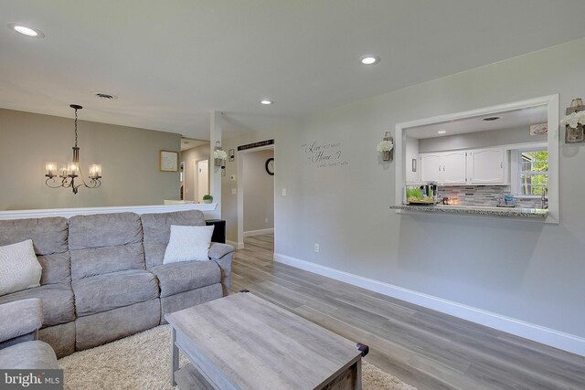 1326 Balsam St, Saint Leonard, MD 20685 - living area with light wood-type flooring, a chandelier, and recessed lighting