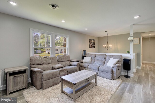 1326 Balsam St, Saint Leonard, MD 20685 - living area with light wood-style floors, a chandelier, and recessed lighting