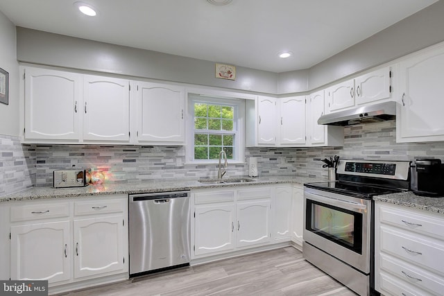 1326 Balsam St, Saint Leonard, MD 20685 - kitchen featuring stainless steel appliances, under cabinet range hood, white cabinetry, and recessed lighting