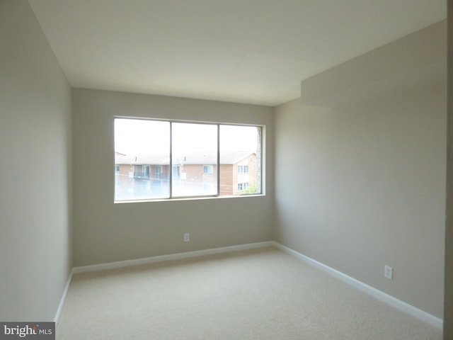431 N Armistead St N Unit 311, Alexandria, VA 22312 - spare room featuring carpet and baseboards