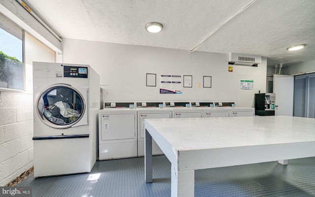 431 N Armistead St N Unit 311, Alexandria, VA 22312 - shared laundry room featuring washing machine and clothes dryer and a textured ceiling