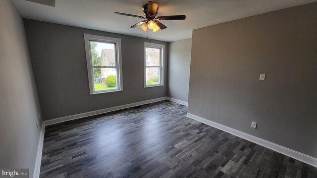 714 Green St, Havre De Grace, MD 21078 - unfurnished room with dark wood-style floors and ceiling fan