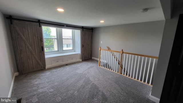 714 Green St, Havre De Grace, MD 21078 - spare room with a barn door, recessed lighting, a smoke detector, and carpet