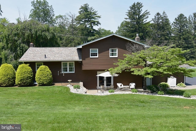 401 Antietam Rd, Reading, PA 19606 - rear view of property with a patio, a lawn, and a chimney