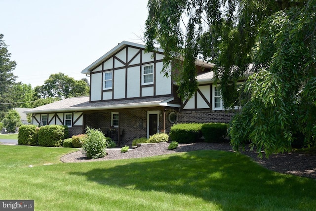 401 Antietam Rd, Reading, PA 19606 - tudor home with stucco siding, a front lawn, and brick siding