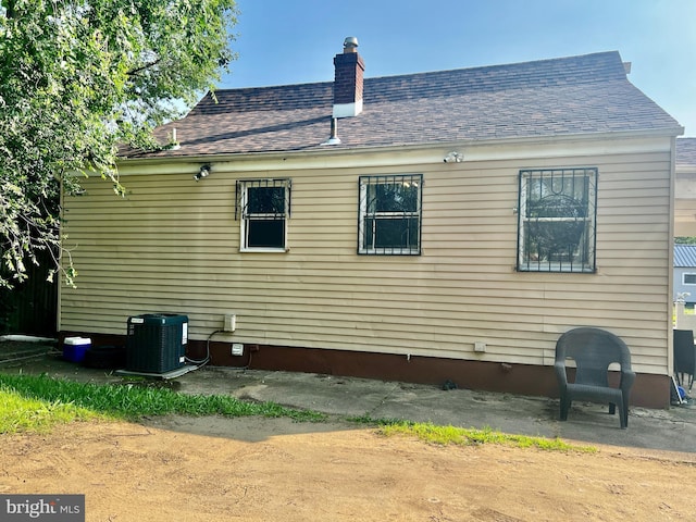 2817 Boyd St, Pennsauken, NJ 08110 - view of home's exterior featuring a chimney and roof with shingles