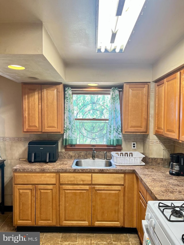 2817 Boyd St, Pennsauken, NJ 08110 - kitchen with light tile patterned flooring and brown cabinetry