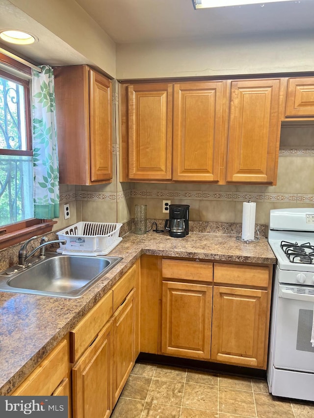 2817 Boyd St, Pennsauken, NJ 08110 - kitchen with gas range gas stove and brown cabinets