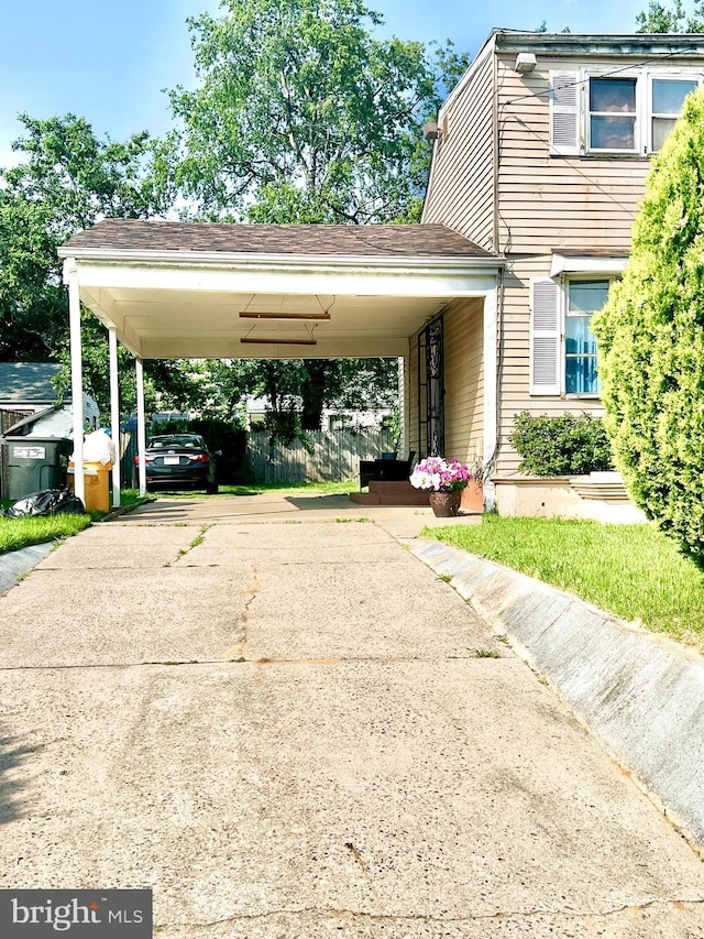 2817 Boyd St, Pennsauken, NJ 08110 - view of parking featuring concrete driveway and a carport