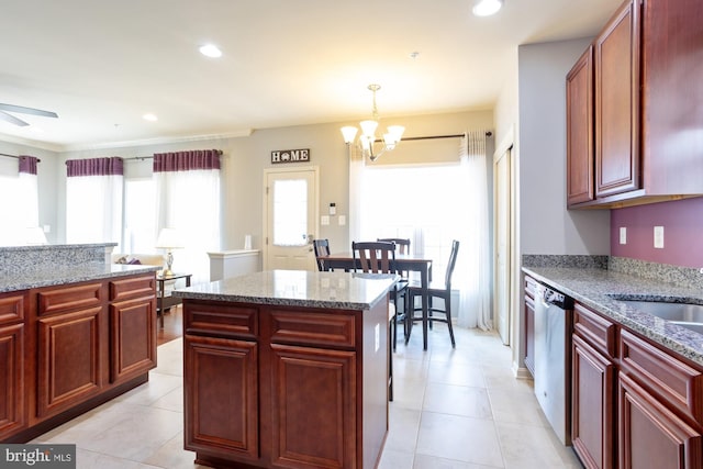 1712 Renaissance Dr, Baltimore, MD 21221 - kitchen featuring dark brown cabinets, a chandelier, light tile patterned floors, light stone counters, and recessed lighting