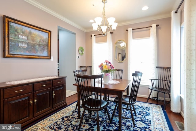 1712 Renaissance Dr, Baltimore, MD 21221 - dining room with dark wood-type flooring, a chandelier, ornamental molding, and recessed lighting