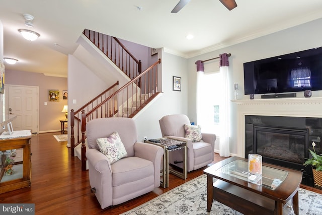 1712 Renaissance Dr, Baltimore, MD 21221 - living room featuring stairs, wood finished floors, a ceiling fan, and ornamental molding