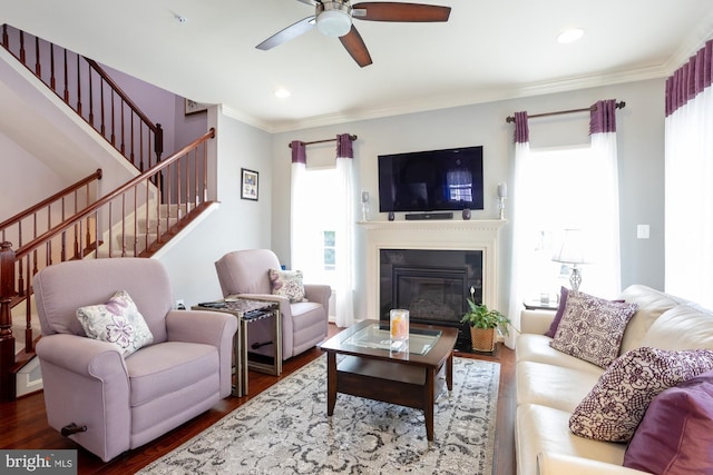 1712 Renaissance Dr, Baltimore, MD 21221 - living room with plenty of natural light, a ceiling fan, stairway, wood finished floors, and ornamental molding