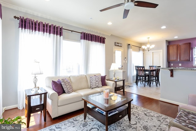 1712 Renaissance Dr, Baltimore, MD 21221 - living room featuring a chandelier, ceiling fan, recessed lighting, and wood finished floors