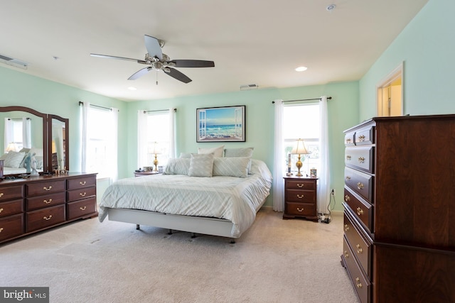 1712 Renaissance Dr, Baltimore, MD 21221 - bedroom featuring light carpet, multiple windows, a ceiling fan, and recessed lighting