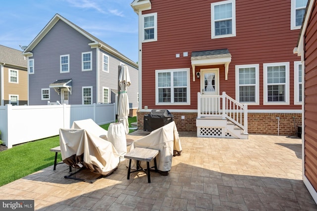 1712 Renaissance Dr, Baltimore, MD 21221 - rear view of property featuring a patio