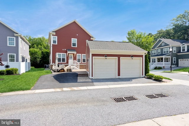 1712 Renaissance Dr, Baltimore, MD 21221 - traditional-style house featuring an attached garage, driveway, and a shingled roof