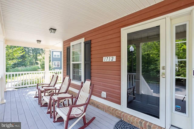 1712 Renaissance Dr, Baltimore, MD 21221 - wooden porch with french doors