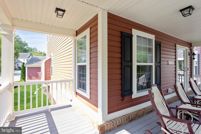 1712 Renaissance Dr, Baltimore, MD 21221 - wooden porch featuring a yard