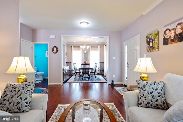 1712 Renaissance Dr, Baltimore, MD 21221 - living area featuring wood finished floors and a chandelier