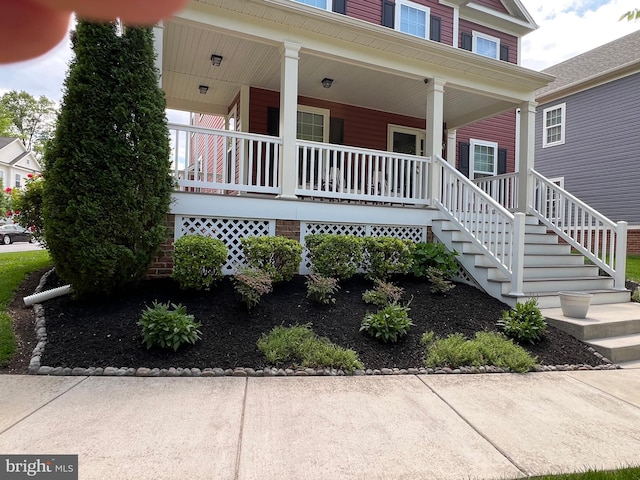 1712 Renaissance Dr, Baltimore, MD 21221 - property entrance featuring covered porch