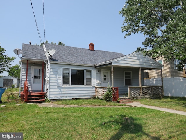 208 Cove St, Crisfield, MD 21817 - bungalow featuring covered porch, a front yard, and a shingled roof