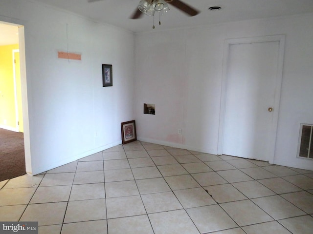 208 Cove St, Crisfield, MD 21817 - unfurnished room with ceiling fan and light tile patterned floors
