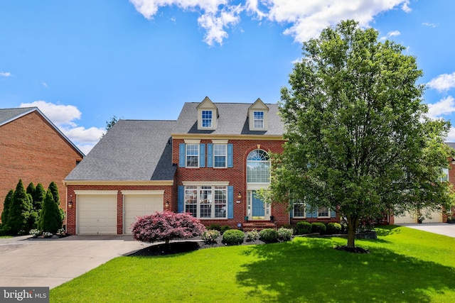 1504 Brookdale Ct, Winchester, VA 22601 - colonial house with brick siding, a garage, a front lawn, and driveway