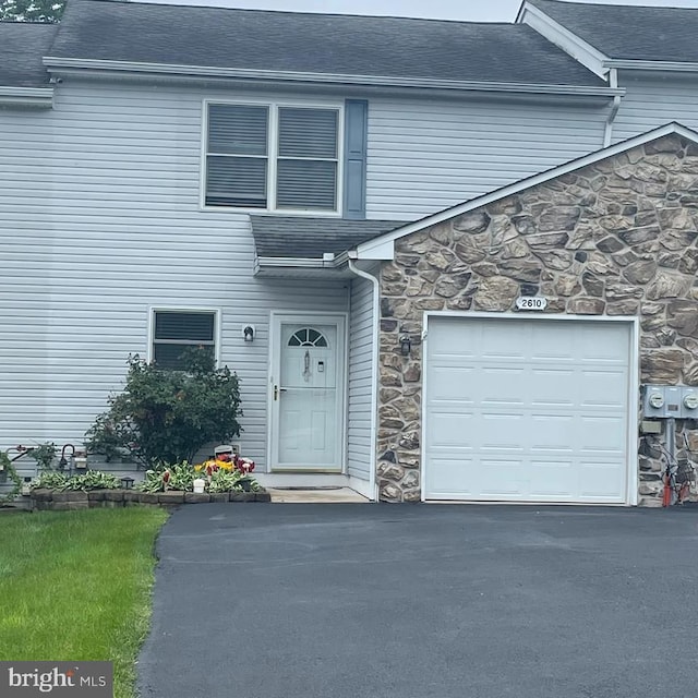2610 Daniels Ln, Quakertown, PA 18951 - view of front facade featuring stone siding, roof with shingles, and asphalt driveway