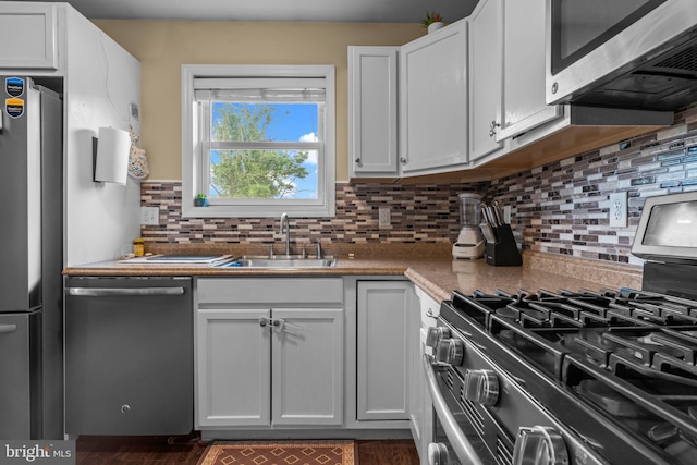 2610 Daniels Ln, Quakertown, PA 18951 - kitchen featuring stainless steel appliances, backsplash, and white cabinetry