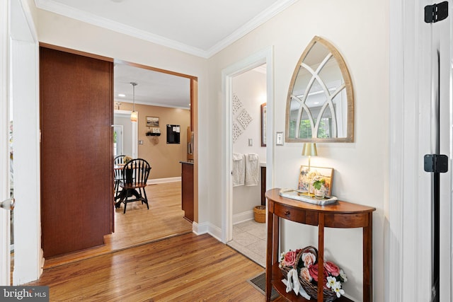 143 Moore Ave, Barrington, NJ 08007 - entryway featuring light wood-style flooring and ornamental molding