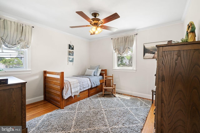 143 Moore Ave, Barrington, NJ 08007 - bedroom featuring wood finished floors, multiple windows, crown molding, and ceiling fan