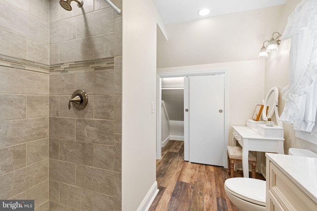 143 Moore Ave, Barrington, NJ 08007 - bathroom with wood finished floors, vanity, a tile shower, and recessed lighting