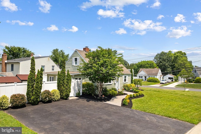 143 Moore Ave, Barrington, NJ 08007 - view of front facade with a chimney and a residential view