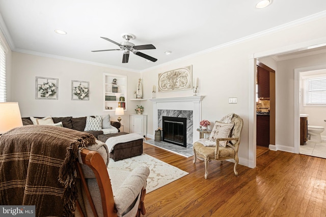 143 Moore Ave, Barrington, NJ 08007 - living room with a ceiling fan, a high end fireplace, wood finished floors, crown molding, and recessed lighting