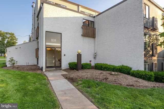 808 Stratford Dr Unit 12, State College, PA 16801 - view of front of home with stucco siding and a front yard