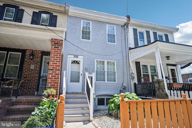 453 Hermitage St, Philadelphia, PA 19128 - view of property featuring covered porch and stucco siding
