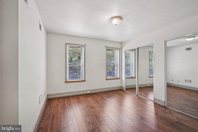 453 Hermitage St, Philadelphia, PA 19128 - unfurnished bedroom with two closets and wood-type flooring
