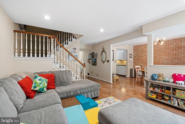 13 Summit Ct, Plymouth Meeting, PA 19462 - living area featuring wood finished floors, stairway, and recessed lighting
