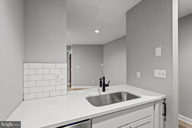 1801 Calvert St NW Unit 204, Washington, DC 20009 - kitchen featuring white cabinets, light stone countertops, and recessed lighting
