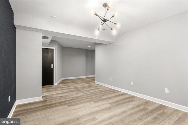 1801 Calvert St NW Unit 204, Washington, DC 20009 - spare room with a chandelier, light wood-type flooring, and recessed lighting