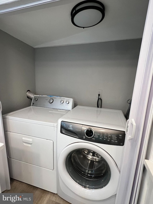 6309 61st Pl, Riverdale, MD 20737 - laundry area featuring washer and dryer and wood finished floors