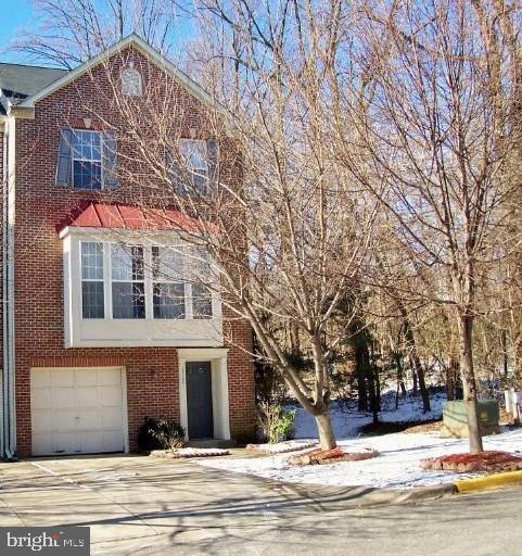 1712 Apple Blossom Ct, Bowie, MD 20721 - view of front facade with brick siding, a garage, and driveway