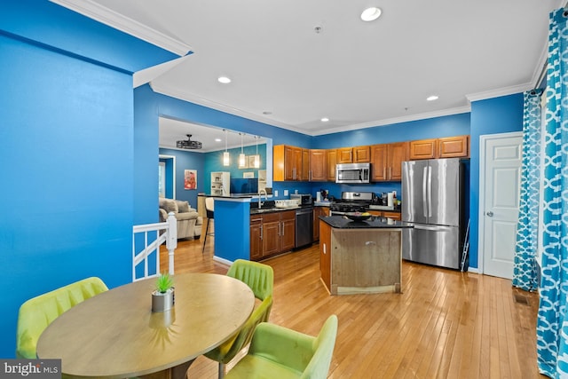 1712 Apple Blossom Ct, Bowie, MD 20721 - kitchen featuring stainless steel appliances, dark countertops, ornamental molding, a kitchen island, and recessed lighting