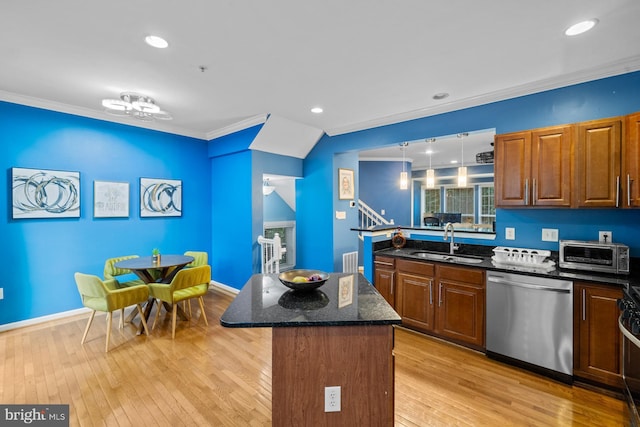 1712 Apple Blossom Ct, Bowie, MD 20721 - kitchen featuring stainless steel dishwasher, crown molding, light wood finished floors, dark stone counters, and a peninsula