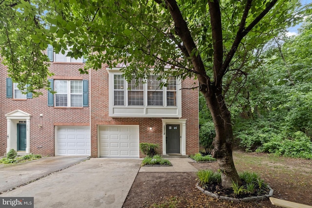 1712 Apple Blossom Ct, Bowie, MD 20721 - townhome / multi-family property with driveway, a garage, and brick siding